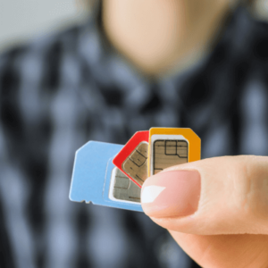 A woman holding eSIM cards