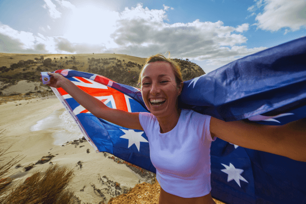 Happy woman holding the flag