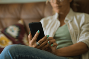 A woman using her smartphone at home