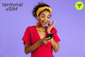 Surprised Happy African Woman in Dress Using Smartphone and Rejoices