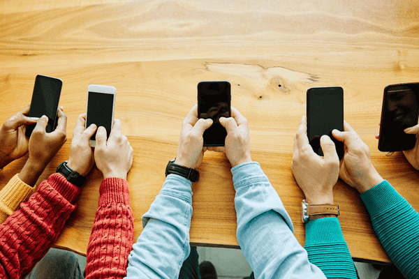 Hands Holding Mobile Phones