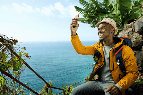 Happy Traveling Man Taking Selfie