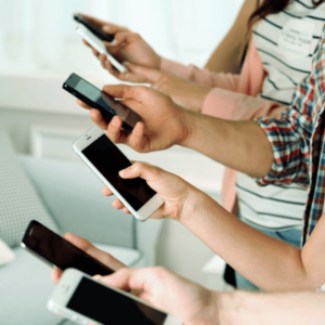 Many Hands Holding Mobile Phones Close up