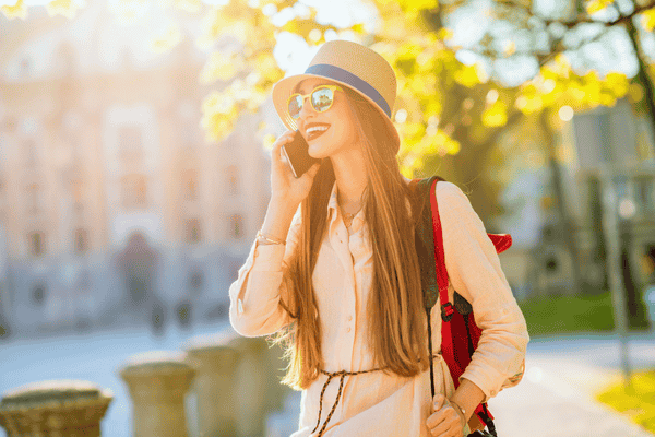 Traveler with mobile phone in the city