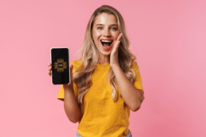 Surprised Young Woman Showing Display of Mobile Phone