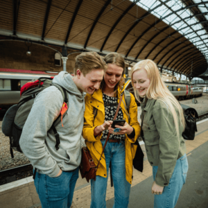 Travelling Tourists Using Phone