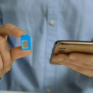 Woman with SIM Card and Smartphone