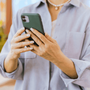 Close-Up Shot of a Person Using a Mobile Phone