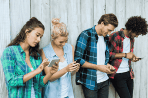 Friends using mobile phone