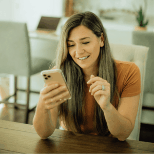 Happy Woman using Mobile Phone 