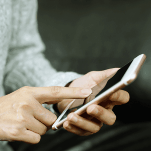 Woman Using Phone Indoors