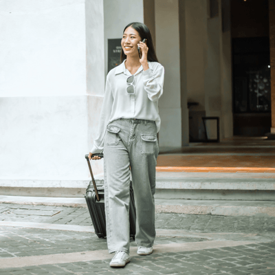 Woman with a phone while traveling
