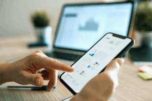 Close up photo of woman using mobile app for finance and stock trading