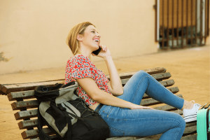 Female Traveler Using Her Phone