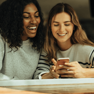 Friends Looking at Mobile Phone
