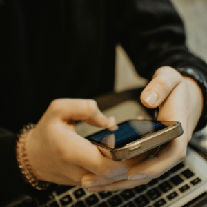 Girl using laptop and mobile phone