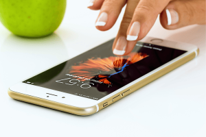 Hand Using Smartphone on White Background