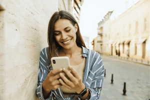 Happy Woman Using a Smart Phone