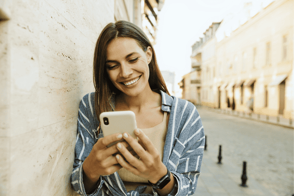 Happy Woman Using a Smart Phone