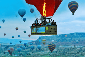 People Flying in a Hot Air Balloon Over Cappadocia