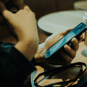 Person Holding Mobile Phone