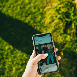 Photo of Person Using Mobile Phone