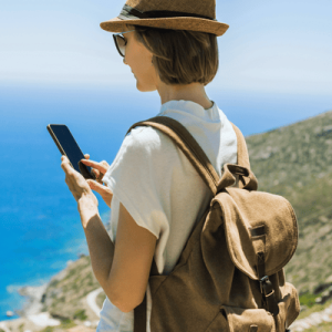 Woman using smart phone during travel