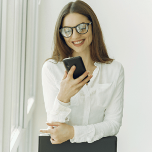 Smiling woman using smartphone 