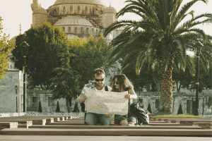Tourist couple reading map and traveling in Istanbul
