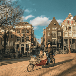 Family Cycling on Traditional Amsterdam Streets