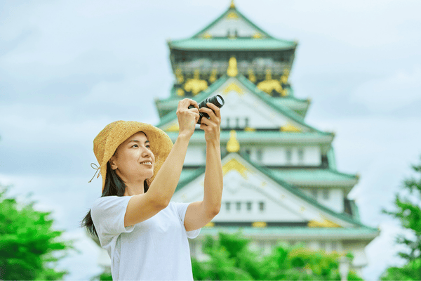 Woman Taking Photos in Front of Osaka Castle