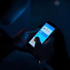 a traveler using mobile phone with eSIM activated