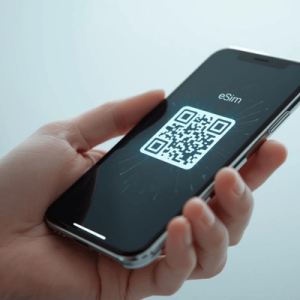a hand holding a mobile phone activated with eSIM QR code