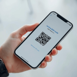 a hand holding a mobile phone with eSIM QR code activated