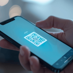 a hand holding a smartphone with activated eSIM QR code