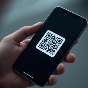a hand holding a smartphone with activated eSIM QR code