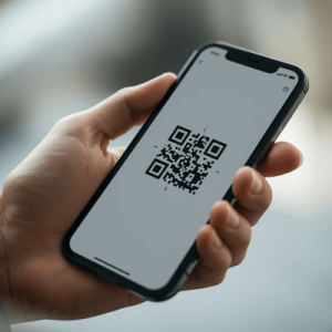 a hand holding a smartphone with activated eSIM QR code