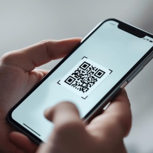 a hand holding a smartphone with activated eSIM QR code