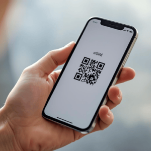 a hand holding a smartphone with activated eSIM QR code
