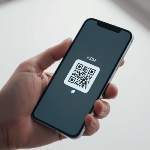 a hand holding a smartphone with activated eSIM QR code