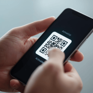 a hand holding a smartphone with activated eSIM QR code