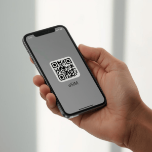 a hand holding a smartphone with eSIM QR code