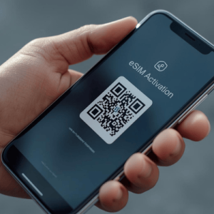 a hand holding a smartphone with eSIM activated QR