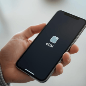 a person holding a mobile phone with eSIM activated