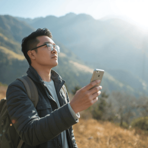 a person holding a smartphone while traveling to Albania