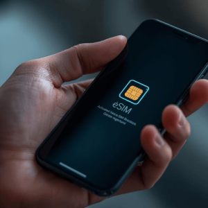 a close-up hand holding a smartphone with eSIM activated