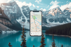 A smartphone showing a digital eSIM connection map with the scenic Canadian Rockies in the background.
